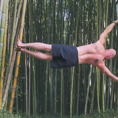 Max performing a human flag during a calisthenics workout