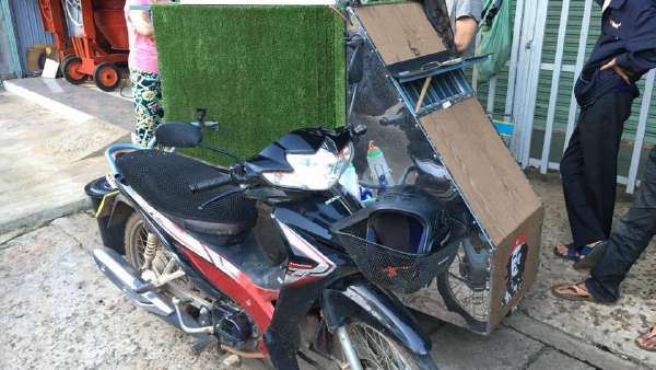 A motorbike with a homemade sleeping sidecar in Vietnam