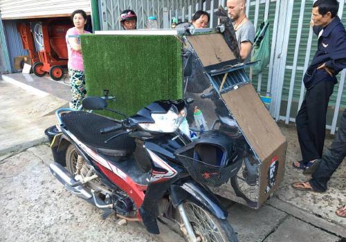 A motorbike with a homemade sleeping sidecar in Vietnam