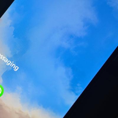 WhatsApp and Signal logos compared on two phones